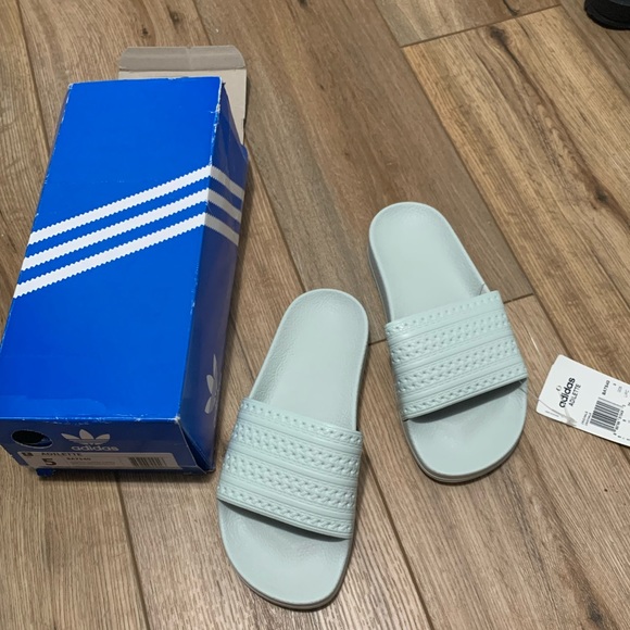green and white adidas slides